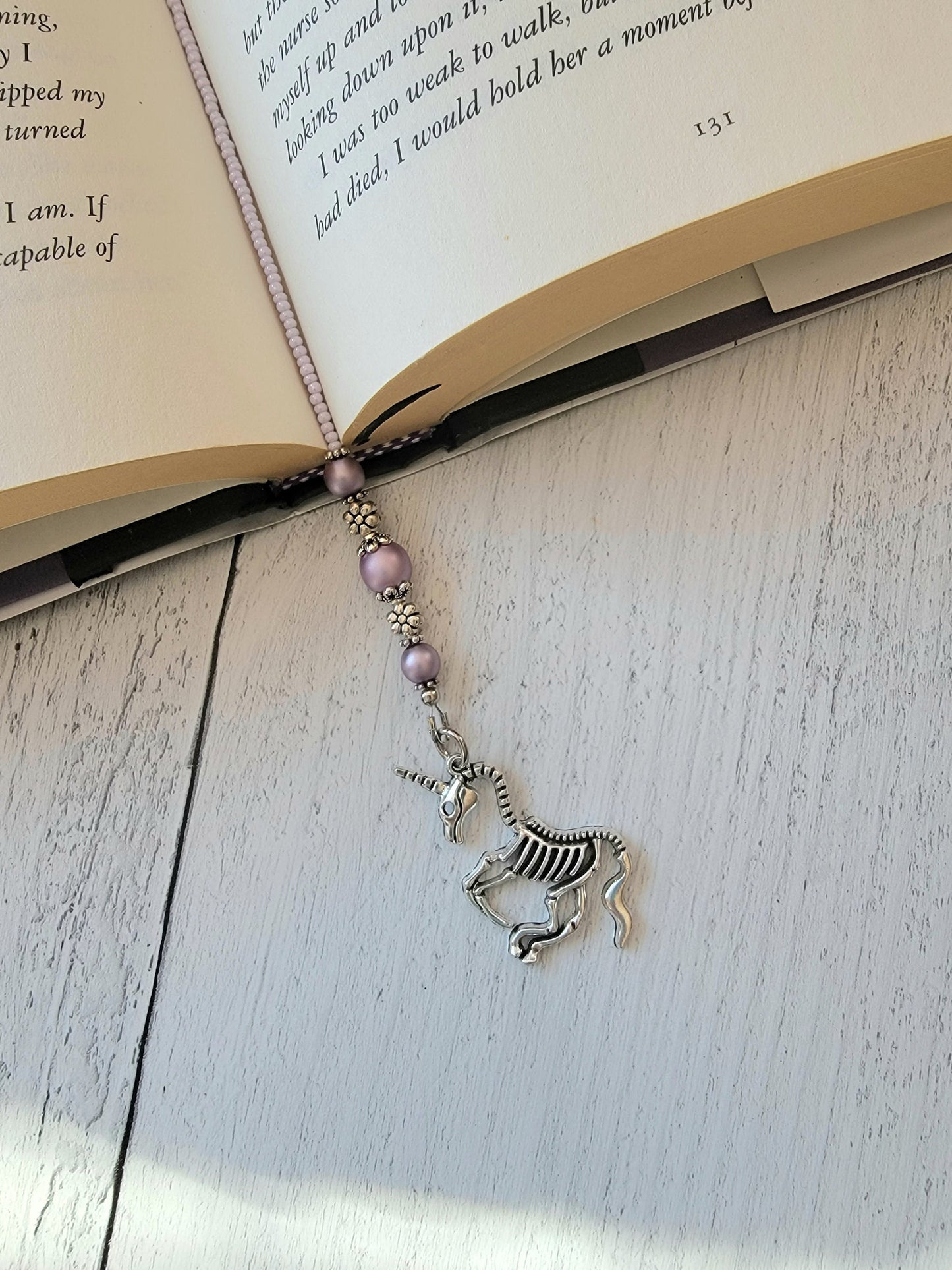 Handcrafted Beaded Bookmark featuring Unicorn Skeleton Charm - Quirky Literary Accessory