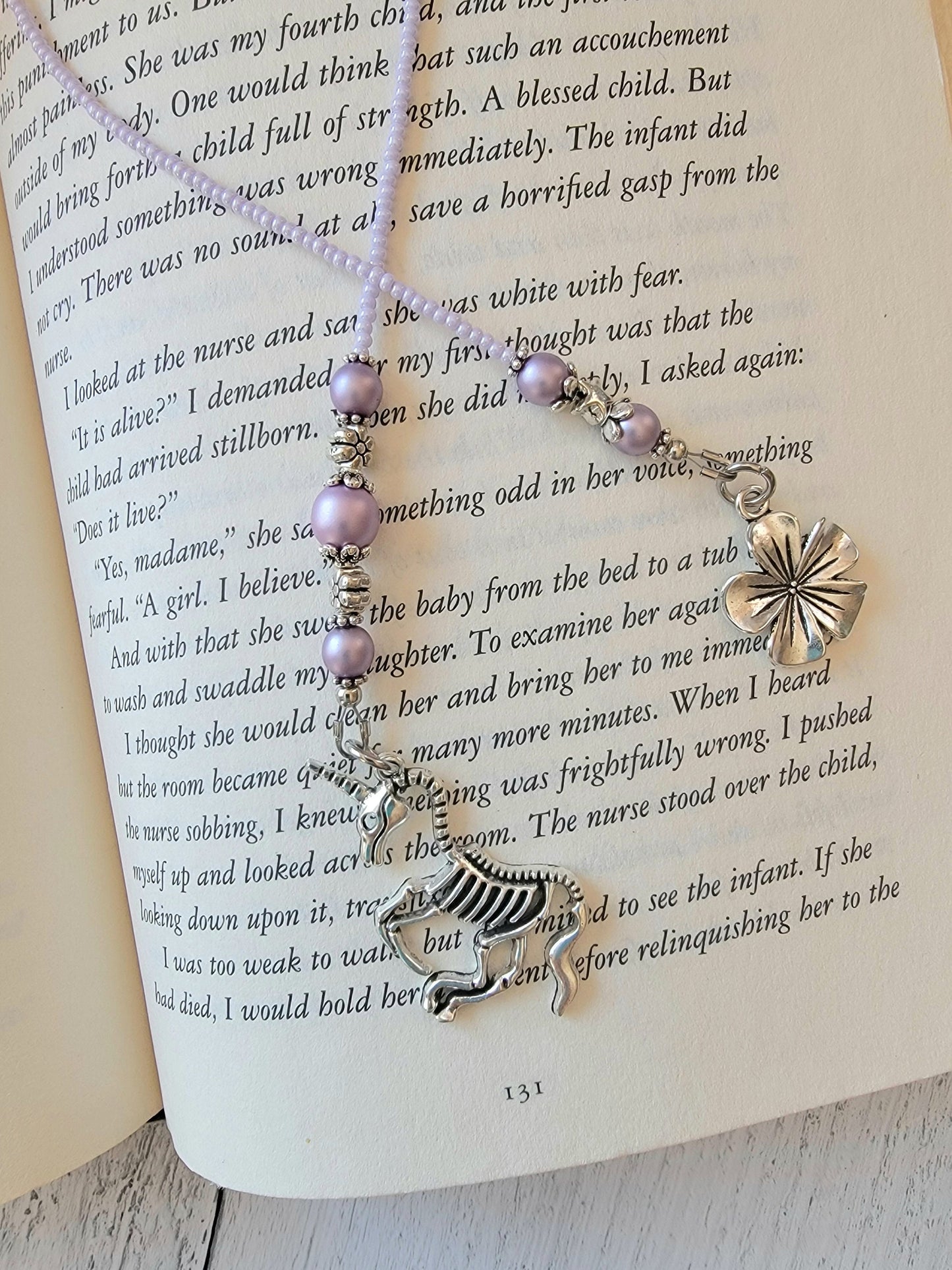 Handcrafted Beaded Bookmark featuring Unicorn Skeleton Charm - Quirky Literary Accessory