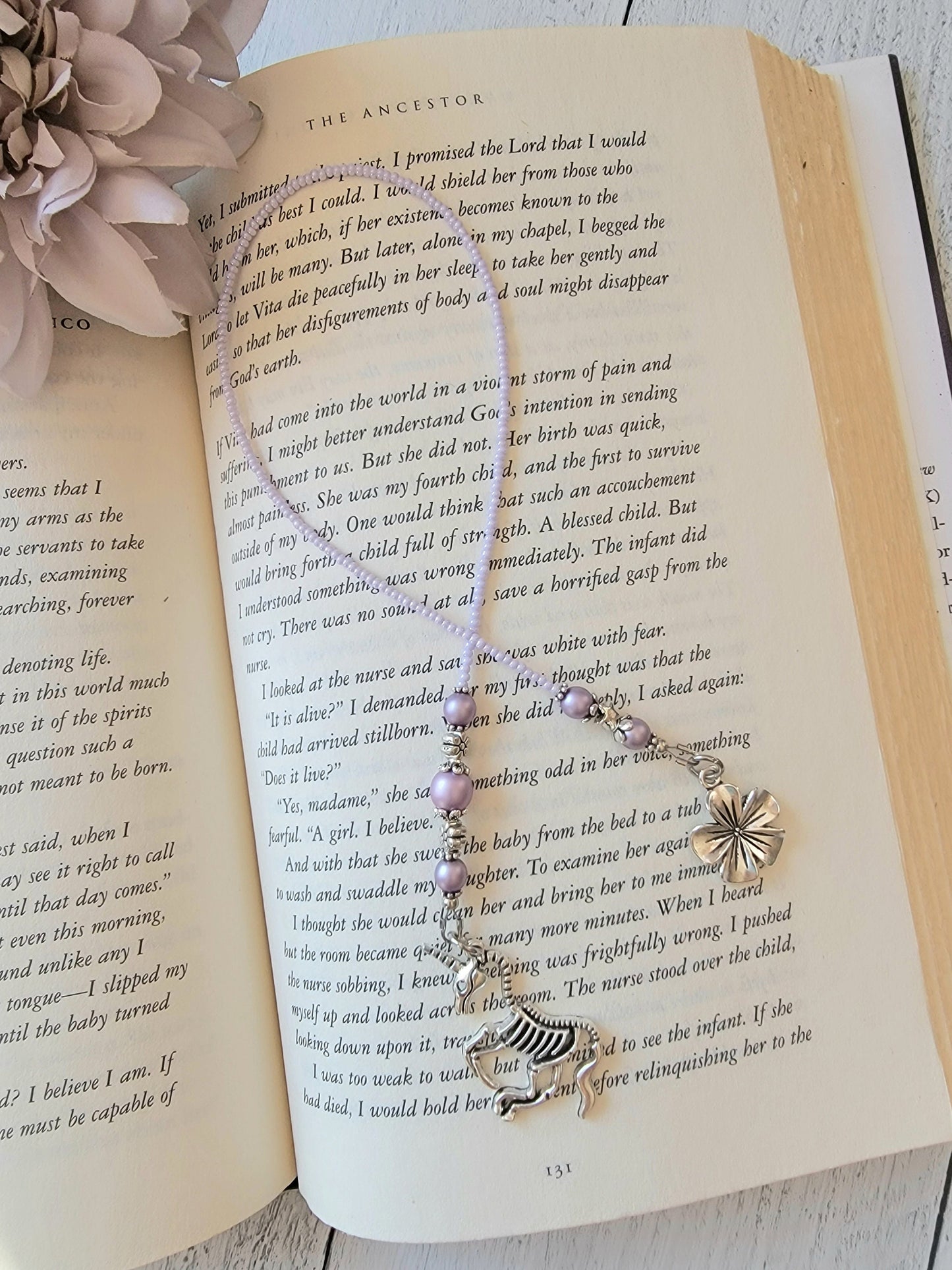 Handcrafted Beaded Bookmark featuring Unicorn Skeleton Charm - Quirky Literary Accessory